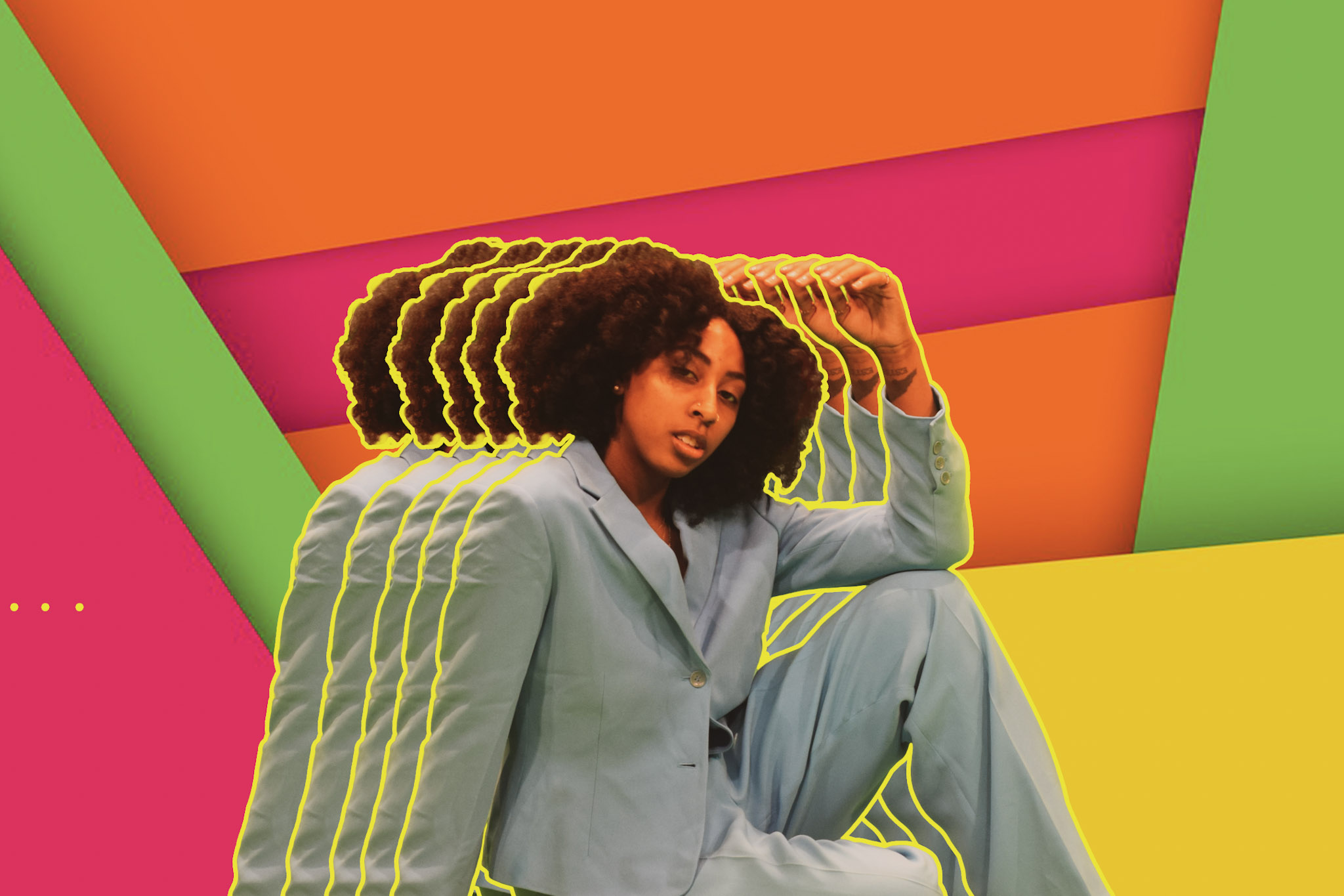 A woman sits down and poses for the camera